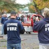 Lemoore Volunteers help to raise the tree.