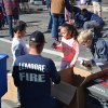 Local children help the firefighters set the bulbs.