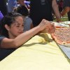 Kaia Gonzales contemplates her next move on pizza.