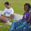 A pair of Tiger athletes take a break Friday night during the track meet.