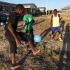 A boy with one shoe on and one shoe off who ran out the dorm when he saw the new soccer balls.