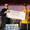 Sergeant Jim Chaney accepts a $1,000 check from Lemoore Lions on behalf of the Police Activities League.