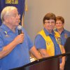 Visiting Lion dignitary Bill Diltz inducts new members into the Kings Lions Club.