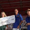 Lynda Lahodny accepts check for Sarah Mooney from Ray Etchgoin and Jeff Garcia