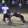 The Crusaders Maiya Garcia blocks a Fresno Christian extra point to preserve the win for his team.