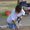 Marie Arruda helps with the landscaping.