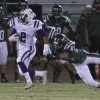 Reggie Davis eludes an El Diamante tackler.