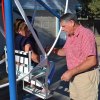 Rick Shimmon takes a look at the Ferris wheel while Jolieann gets ready for another ride.