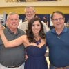 Don Warkentin, Tim Wahl and Jay Salyer admire the firearms Saturday night.