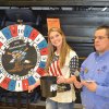 Paul Rodarmel helps spin the wheel for a chance at a firearm.