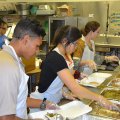 Volunteers are busy preparing meals to feed about 2,000 persons.