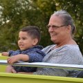 These two are enjoying their ride in a Lemoore Volunteer Fire Department truck.