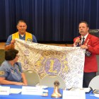 Kings Lions President Roman Benitez and District Governor Al Kroell with signed banner to be taken to Chicago Lions International Convention.