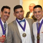 Football players celebrate after induction into the Hall of Fame.