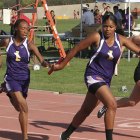 Azalea Johnson hands off to Miracle Stroughter in the relay event.