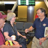 Central Valley Honor Flight Director Al Perry greets veterans.