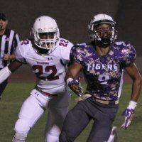 Lemoore's Allen Perryman keeps his eye on the ball.