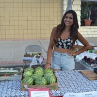 Audrey Badasci tends her family's fruit stand at the Farmers' Market.