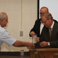 Hall of Fame newcomer Bob Clement is greeted by Foundation President Bill Black.