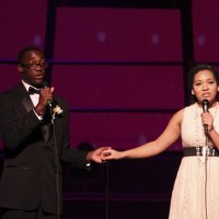 Jeremy Lucky and Serena Mendoza singing "Cheek to Cheek."