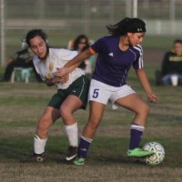 Lemoore's Keelynn Kaalekahi tangles with a player from Sierra Pacific.