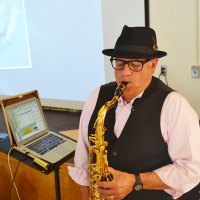 Former LHS Principal and current member of the board of trustees and the LHS Foundation, Lupe Solis entertains the audience with his superb saxophone playing.