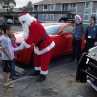 Santa and the Lemoore Police deliver another present as part of "Presents on Patrol."