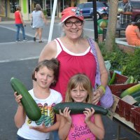 Sherrie Schweizer and kids Stella and Sadie enjoy the Farmers' Market.