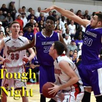 Jaylunn English and Matt Borba defend the basket in Friday night's loss at Hanford.