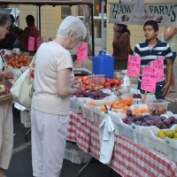 These two ladies check out the produce at the Farmers' Market.