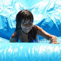 Enjoying the water slide.