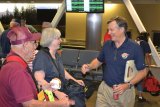 Central Valley Honor Flight Director Al Perry greets veterans.