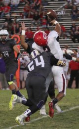 Cedric Vasquez makes a tackle as Lemoore's defense played Sanger tough.