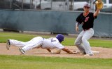 Cameon Dominguez slides back to first base in Friday's game against Hanford.