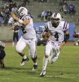 Mitchell Lawrence (72) blocks for Cort Groathouse.