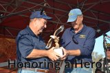 Former Navy aviator Jim Lloyd presents a Veterans' Award to Capt. Harry Zinser during ceremonies Wednesday at the Kings County Fairgrounds.