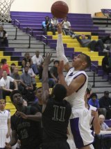 Jordan Honeywood had 13 points and 17 rebounds to lead the Tigers past Hoover in the opening round of the Division II playoffs.