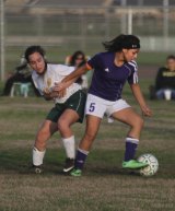 Lemoore's Keelynn Kaalekahi tangles with a player from Sierra Pacific.