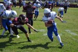 A Crusader goes for a tackle during last week's game against Desert Christian.