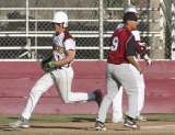 The Crusaders' Mason Munoz scores in the 6th inning as Kings Christian beats Orosi 5-2 in the East Sierra League opener.