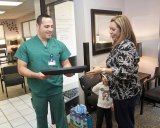 Lemoore resident Ceci Mattingly gives her doctor, Sayed Basel a certificate of appreciation.