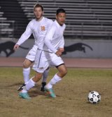 Lemoore's Missael Aguilar keeps his eye on the ball. He scored Lemoore's winning goal against Corcoran Tuesday night.