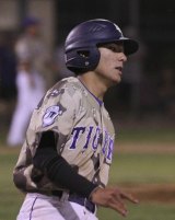 Nate Corona hits safely in the game against Mt. Whitney.