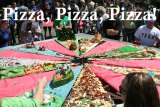 One of the highlights of the annual Central Valley Pizza Festival is the giant pizza.