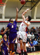 Reggie Davis battles for the ball in Hanford game.