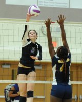 Sarah McCann leaps high for the ball against Sunnyside