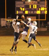 Lemoore's Trenton Mcghuey goes for the ball