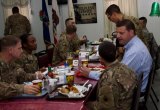 U.S. Representative David V aladao having Christmas dinner with U.S. troops.