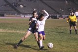 Lemoore's Yavilex Ledezman keeps her eye on the ball during overtime loss to Redwood.