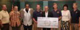 Rotarians present councilmembers with $3,000 check. From left to right: Councilmember Ray Madrigal, Councilmember Willard Rodarmel, Councilmember Eddie Neal, Victor Rosa, Mayor Billy Siegel, Walt Stammer, Councilmember Lois Wynne, and Kurt Quade. 